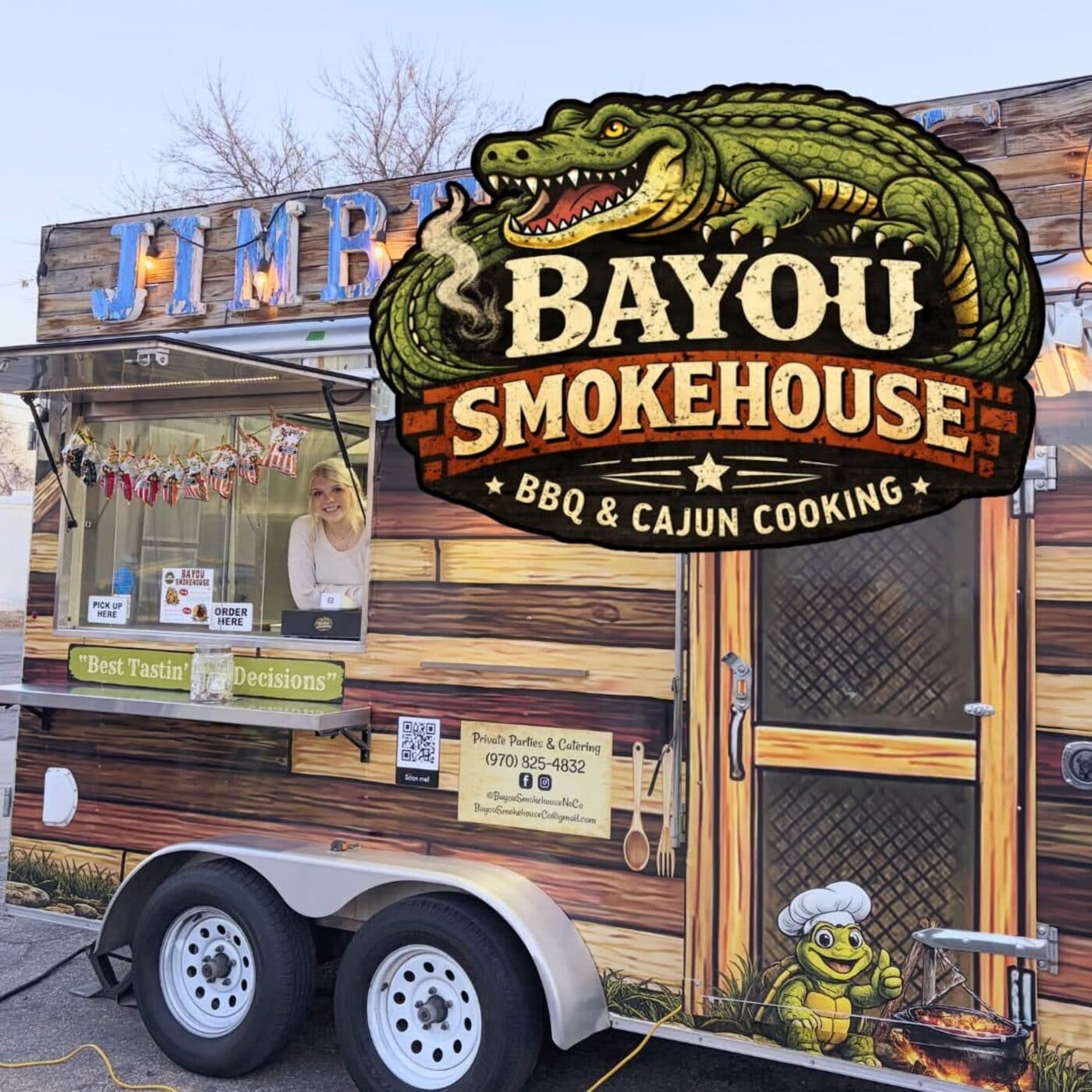 The Bayou Smokehouse food truck with its green alligator sign